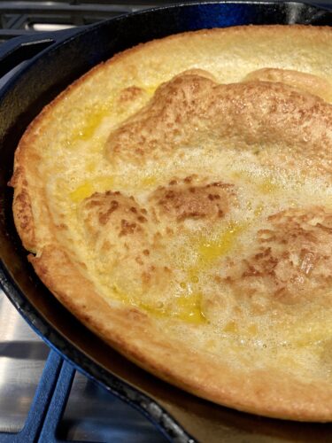 gluten free dutch baby puff pancake in a cast iron skillet